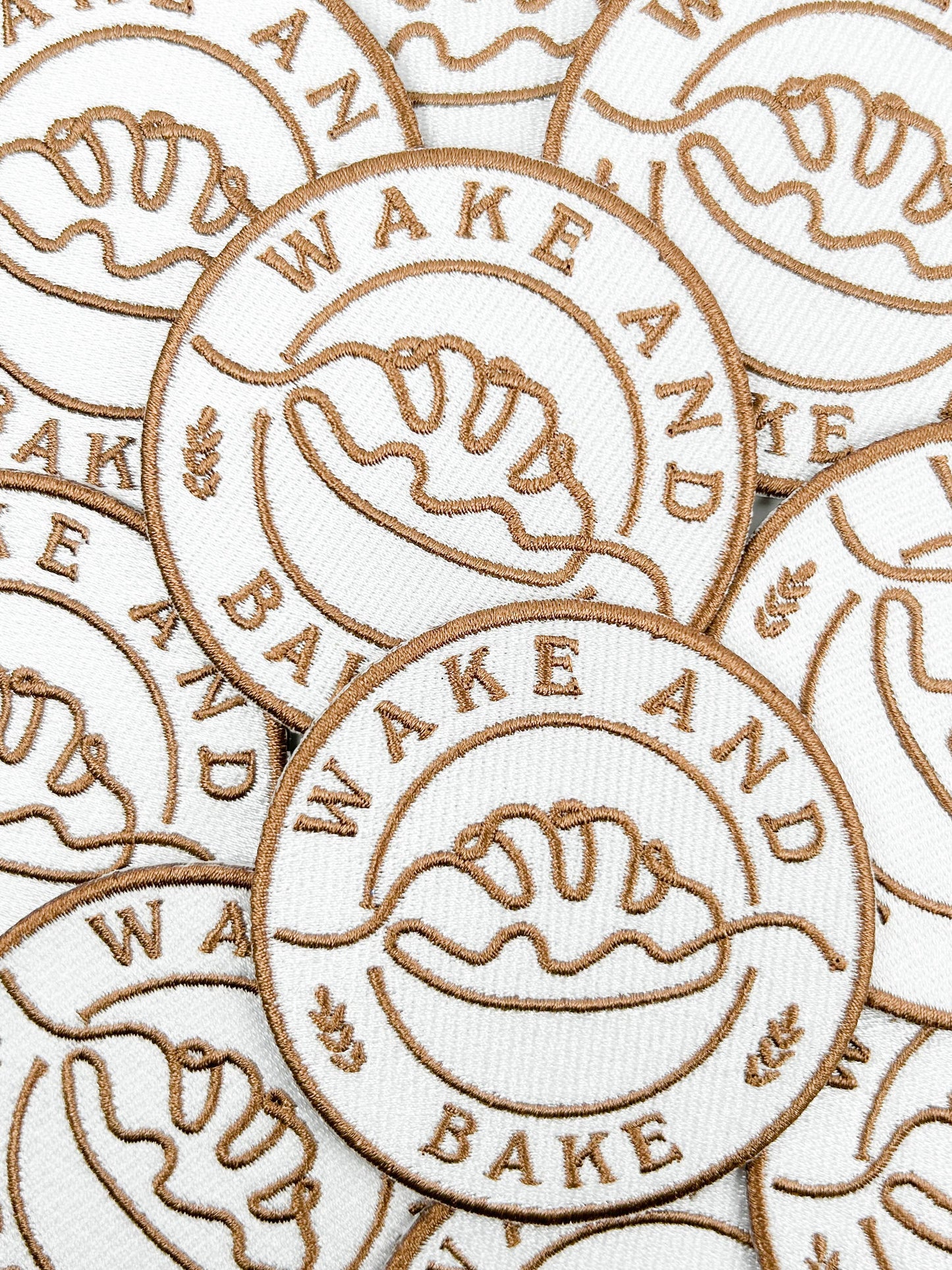 Multiple 'Wake and Bake' branded items with logo on a white background