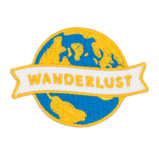 Embroidered patch with 'Wanderlust' text and blue and yellow design on a white background