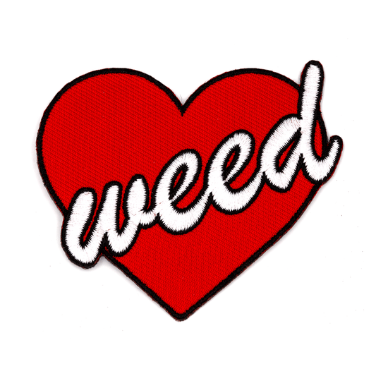 Heart-shaped patch with 'weed' text on a white background