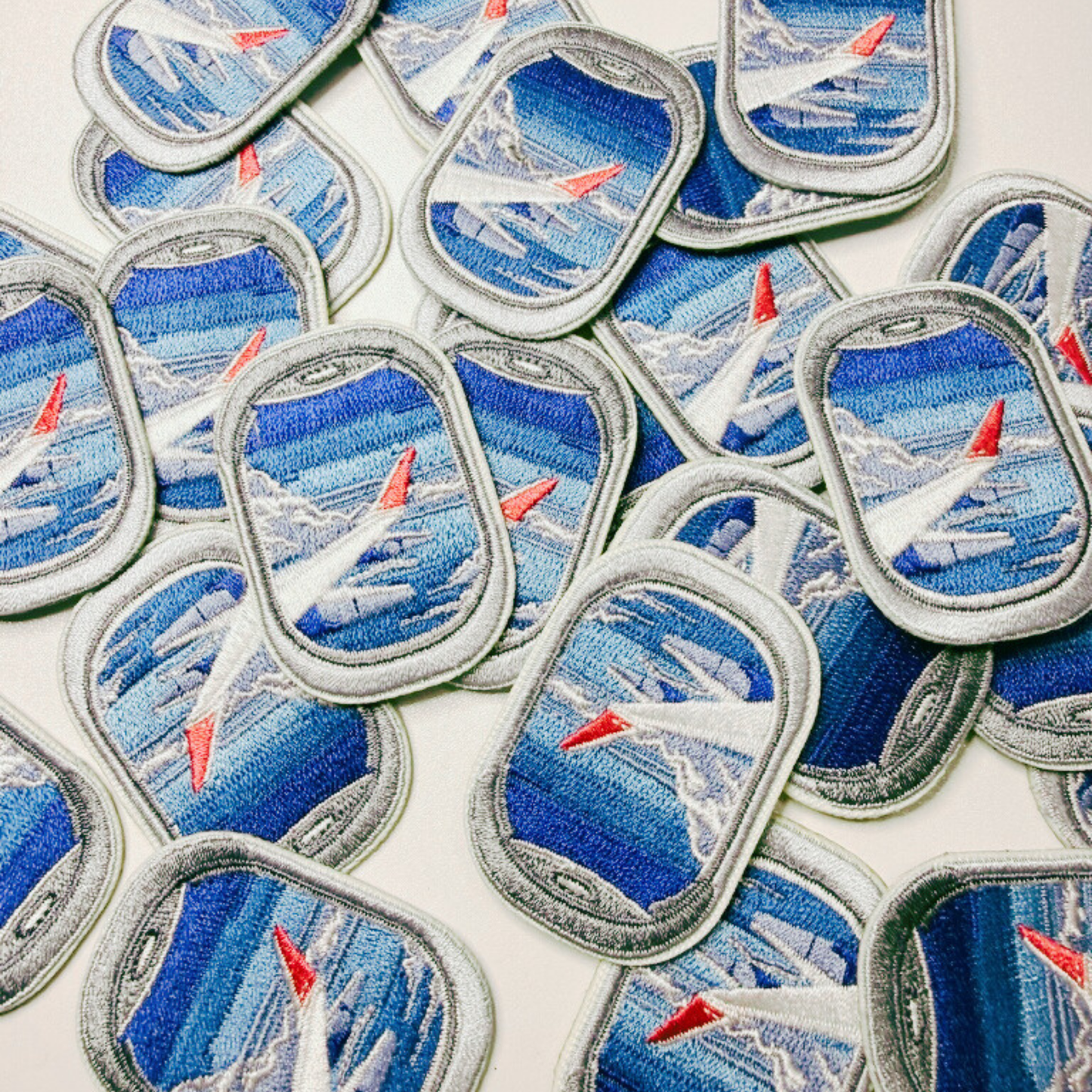 Collection of airplane-themed patches on a white background