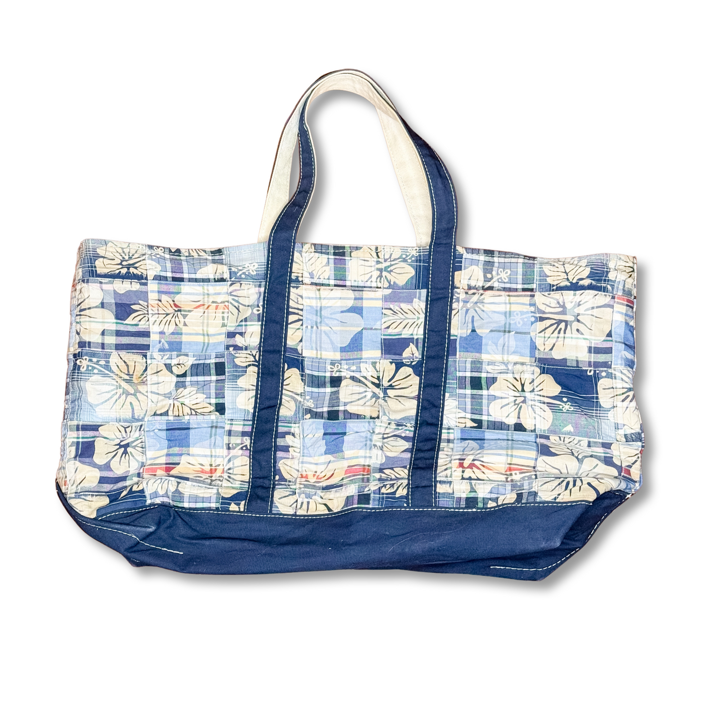 Blue and white floral patterned tote bag on a white background