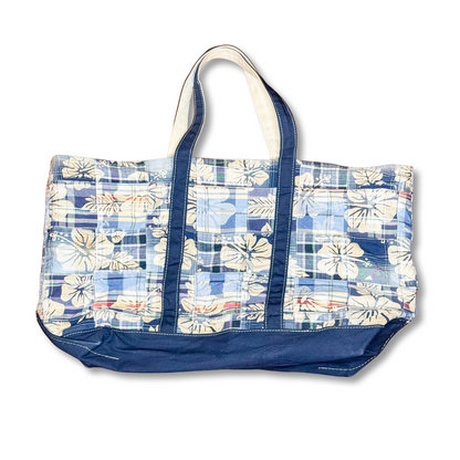 Blue and white floral patterned tote bag on a white background