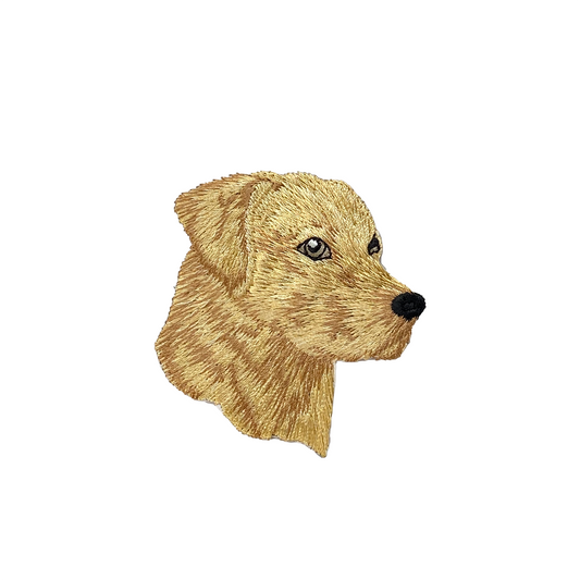 Embroidered patch of a dog's head on a white background
