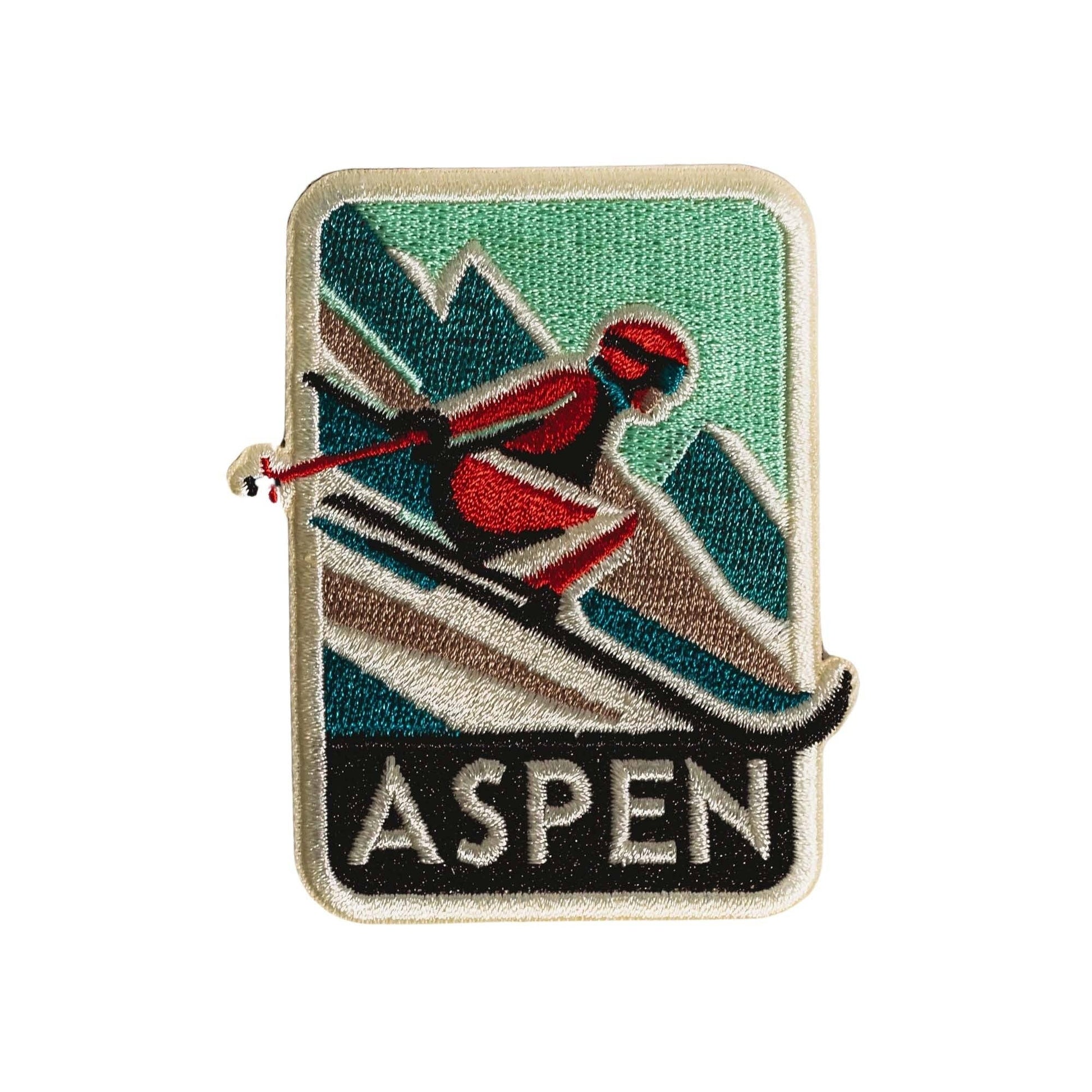 Embroidered patch with a skier design and 'Aspen' text on a white background
