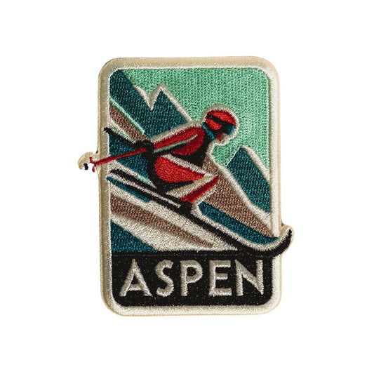 Embroidered patch with a skier design and 'Aspen' text on a white background
