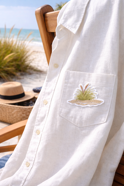 White shirt with a seagrass on a beach patch on a beach chair