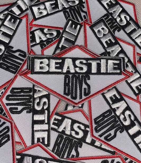 Multiple patches with 'Beastie Boys' text on a gray background