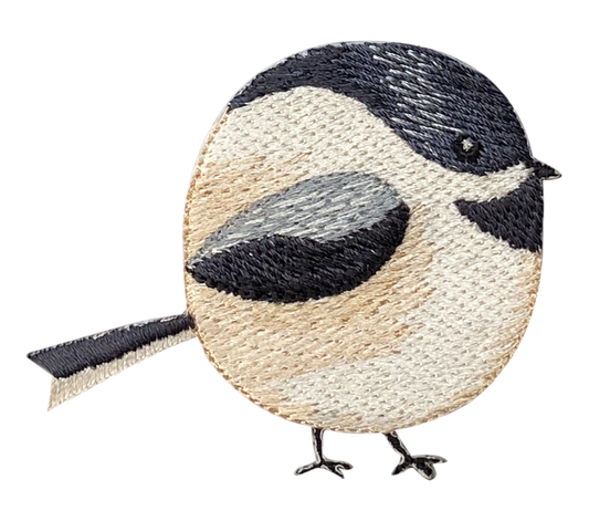 Embroidered patch of a chubby chikadee on a white background