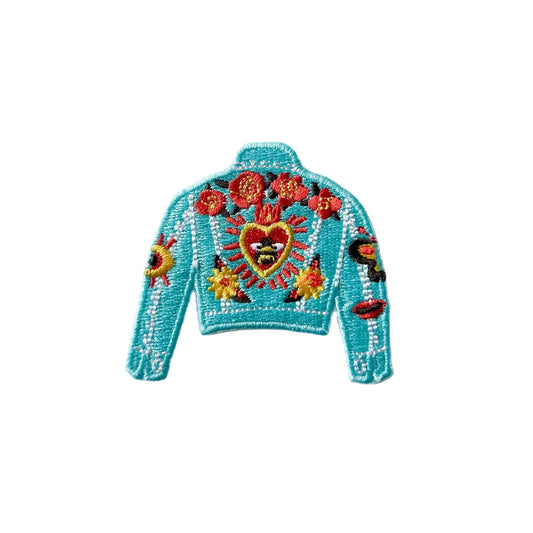 Colorful embroidered jacket design patch on a light gray background