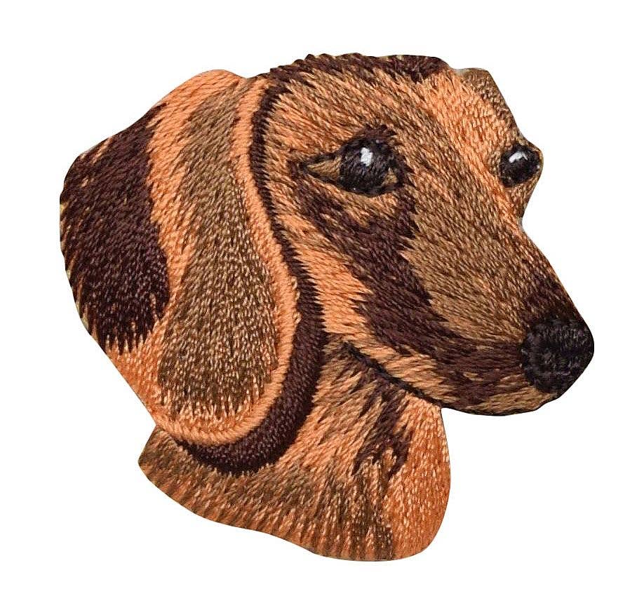Embroidered patch of a dachshund dog's head on a white background