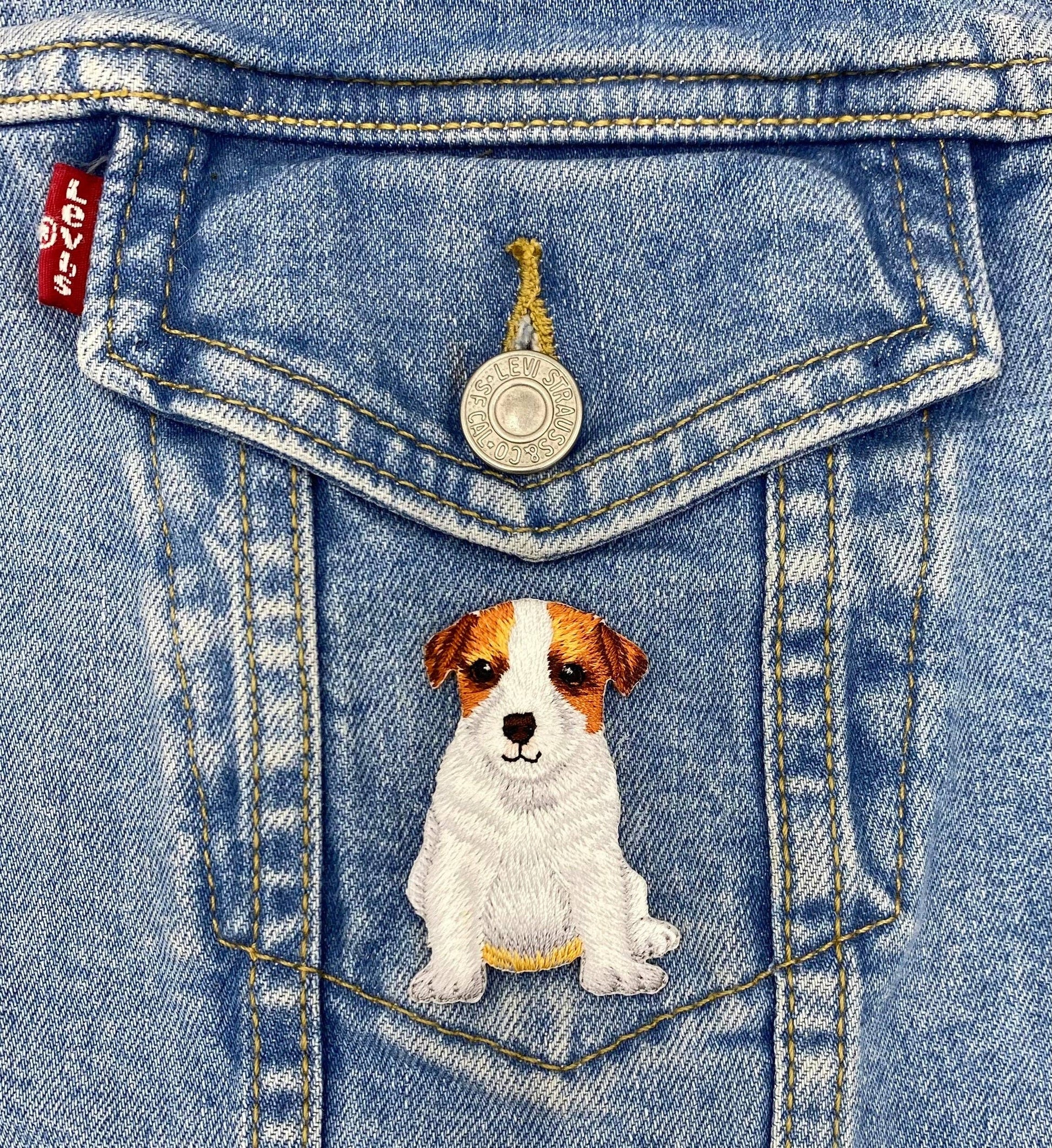 Denim jacket with a dog patch on the pocket