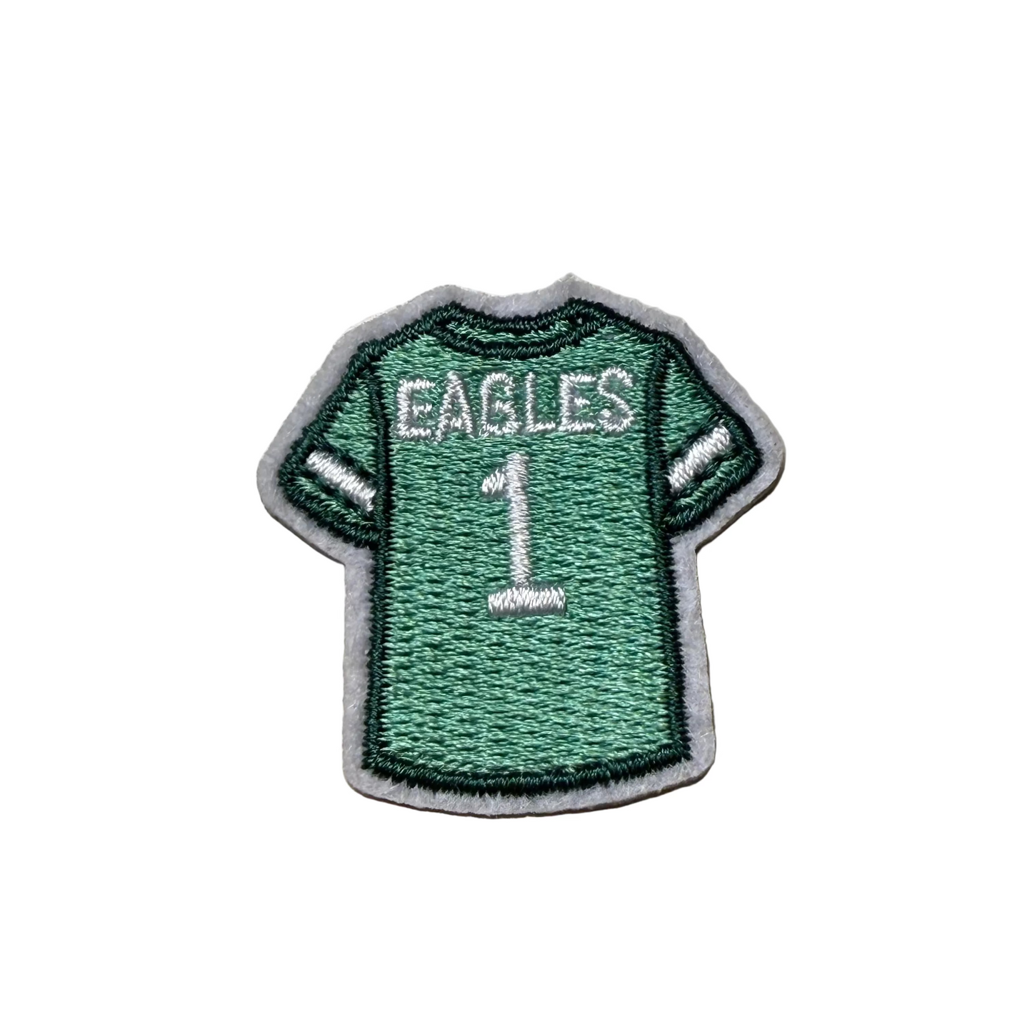 Green jersey patch with 'EAGLES' and number '1' on a light gray background