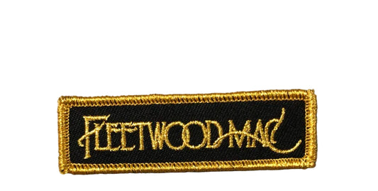 An embroidered patch with 'Fleetwood Mac' text on a white background