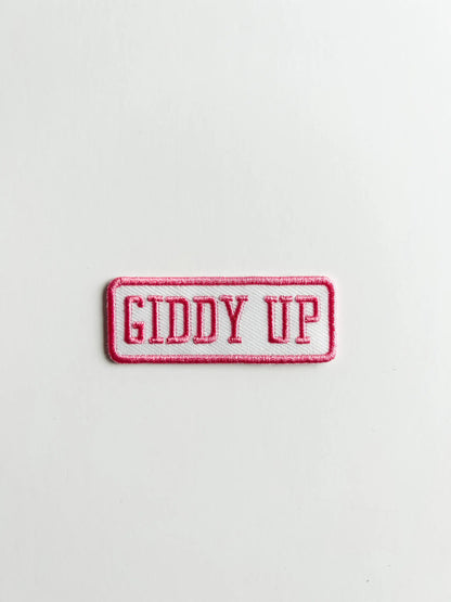 Embroidered patch with 'GIDDY UP' text on a white background
