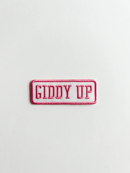 Embroidered patch with 'GIDDY UP' text on a white background
