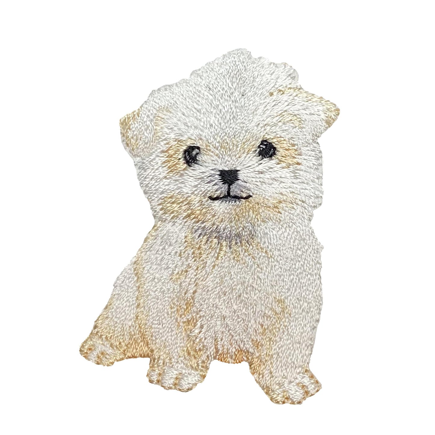 Embroidered patch of a fluffy white maltese dog on a white background