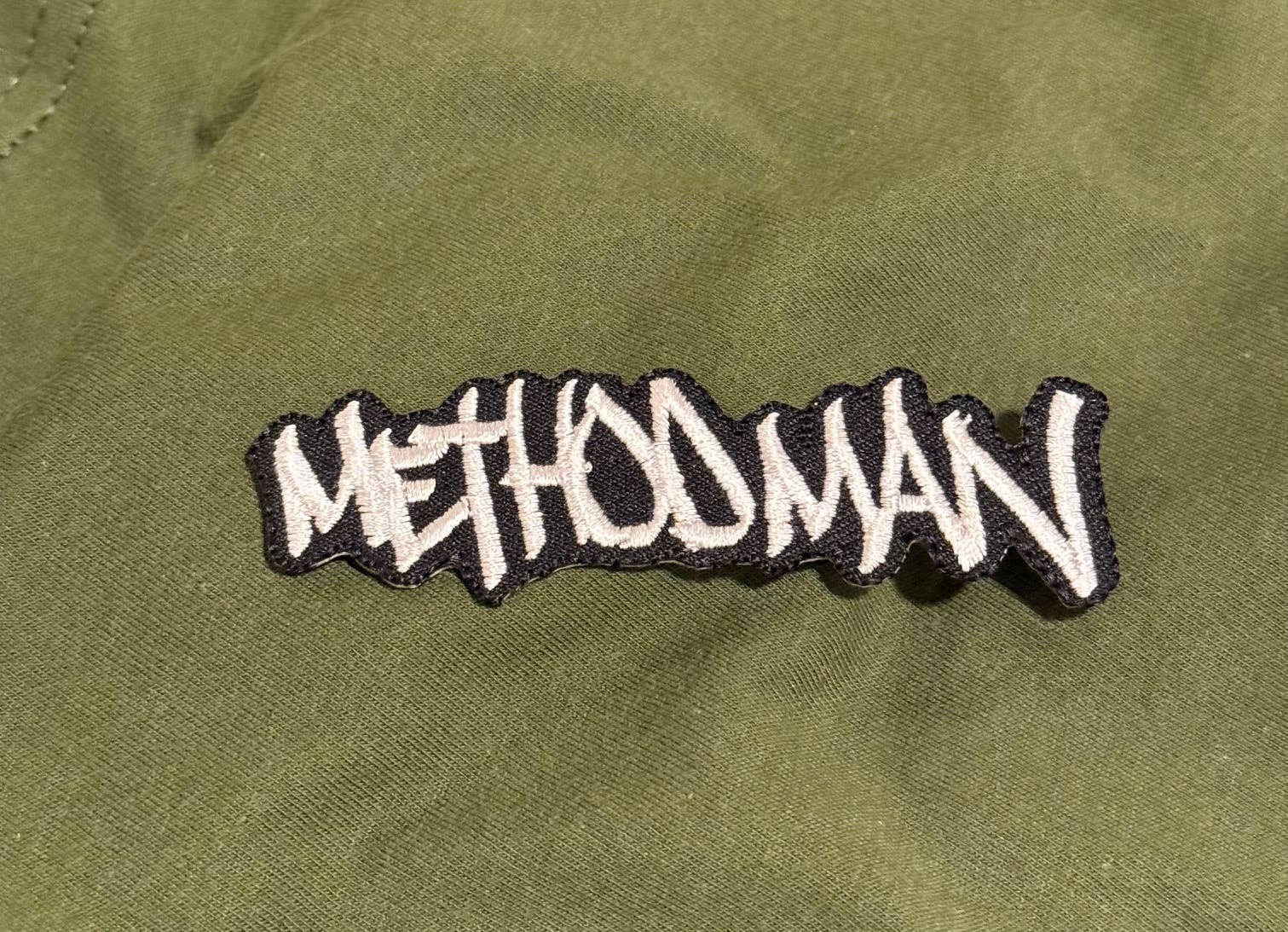 Embroidered patch with 'Methood Man' text on a green fabric background