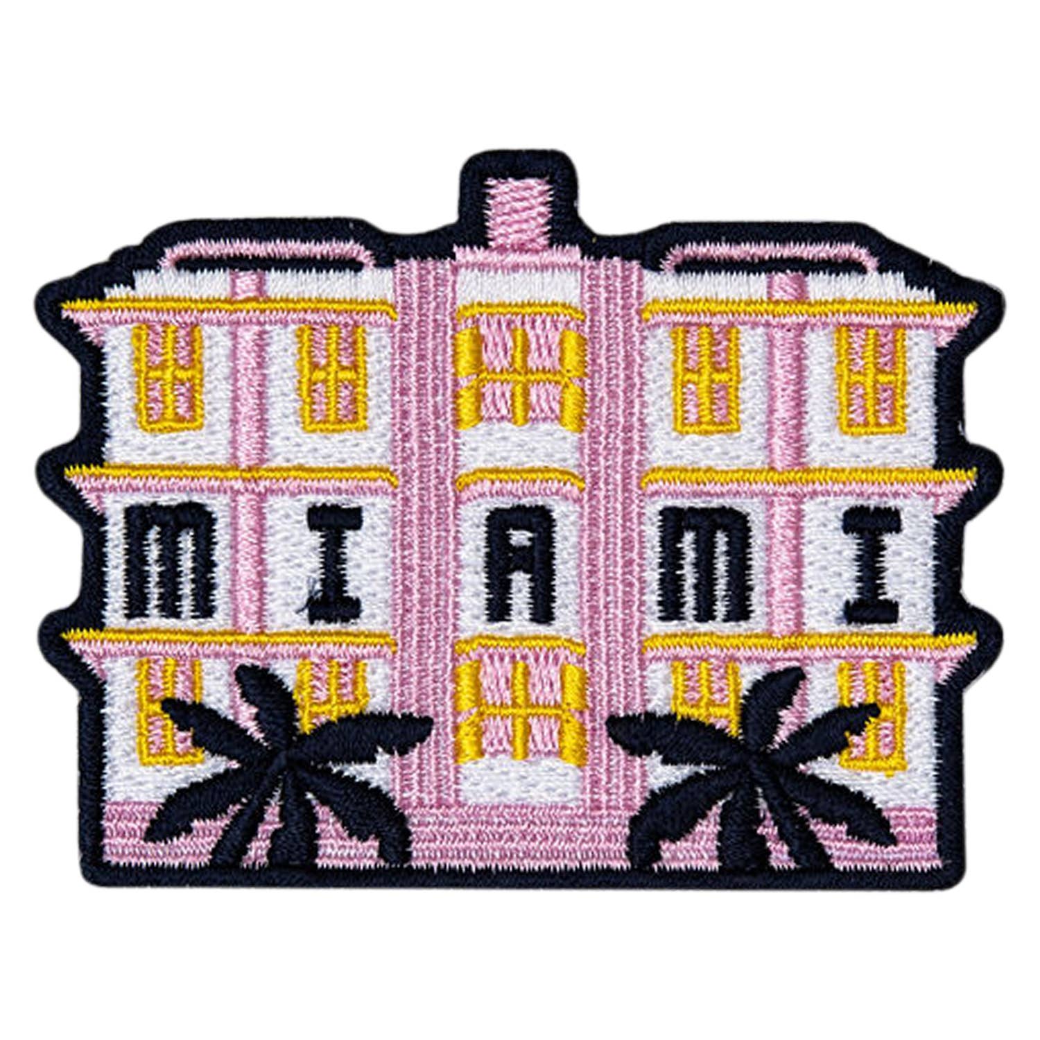 Embroidered patch of a pink building with 'Miami' and palm trees on a white background