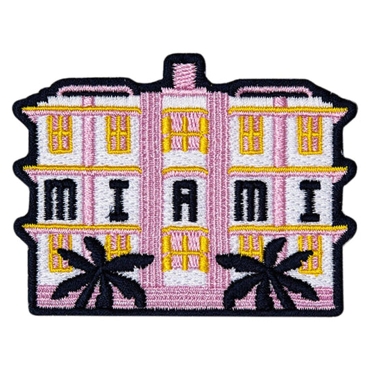 Embroidered patch of a pink building with 'Miami' and palm trees on a white background