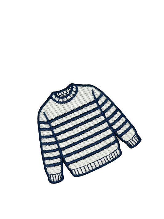 Striped sweater with navy and cream colors on a white background