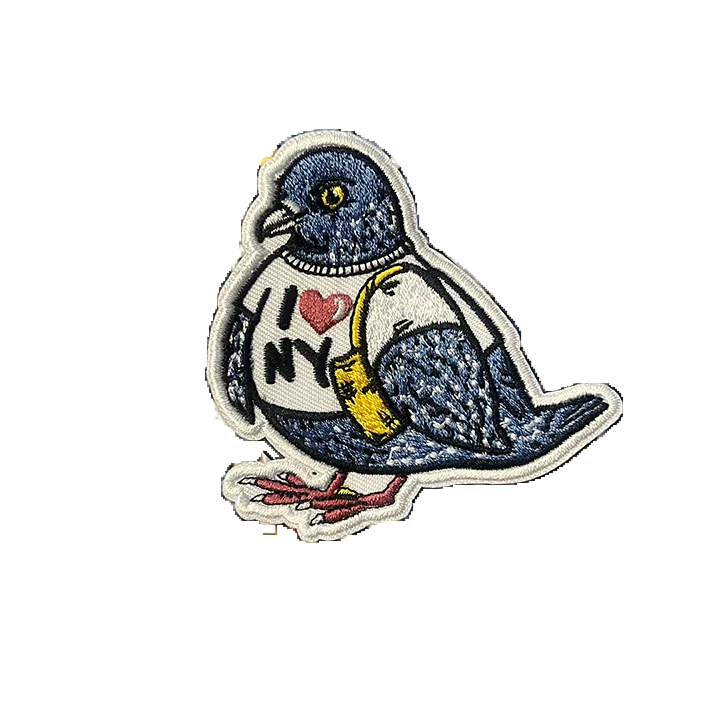 Embroidered patch of a pigeon with 'I ❤️ NY' on a white background