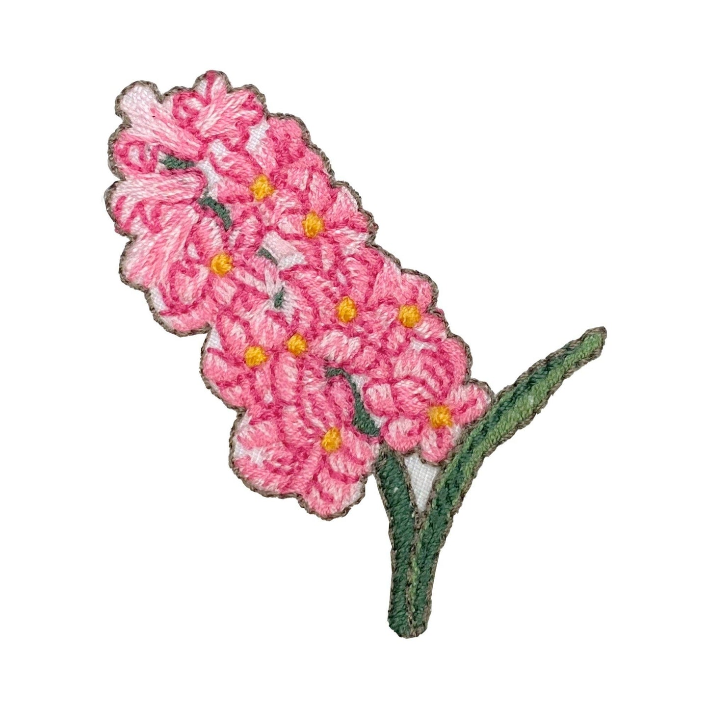 Embroidered pink hyacinths with green leaves and stem on a white background