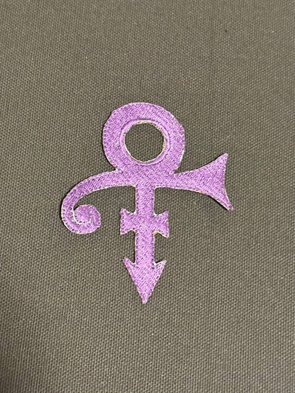 Purple symbol on a textured grey background