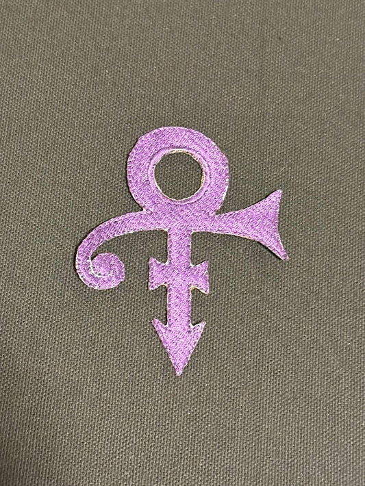 Purple symbol on a textured grey background