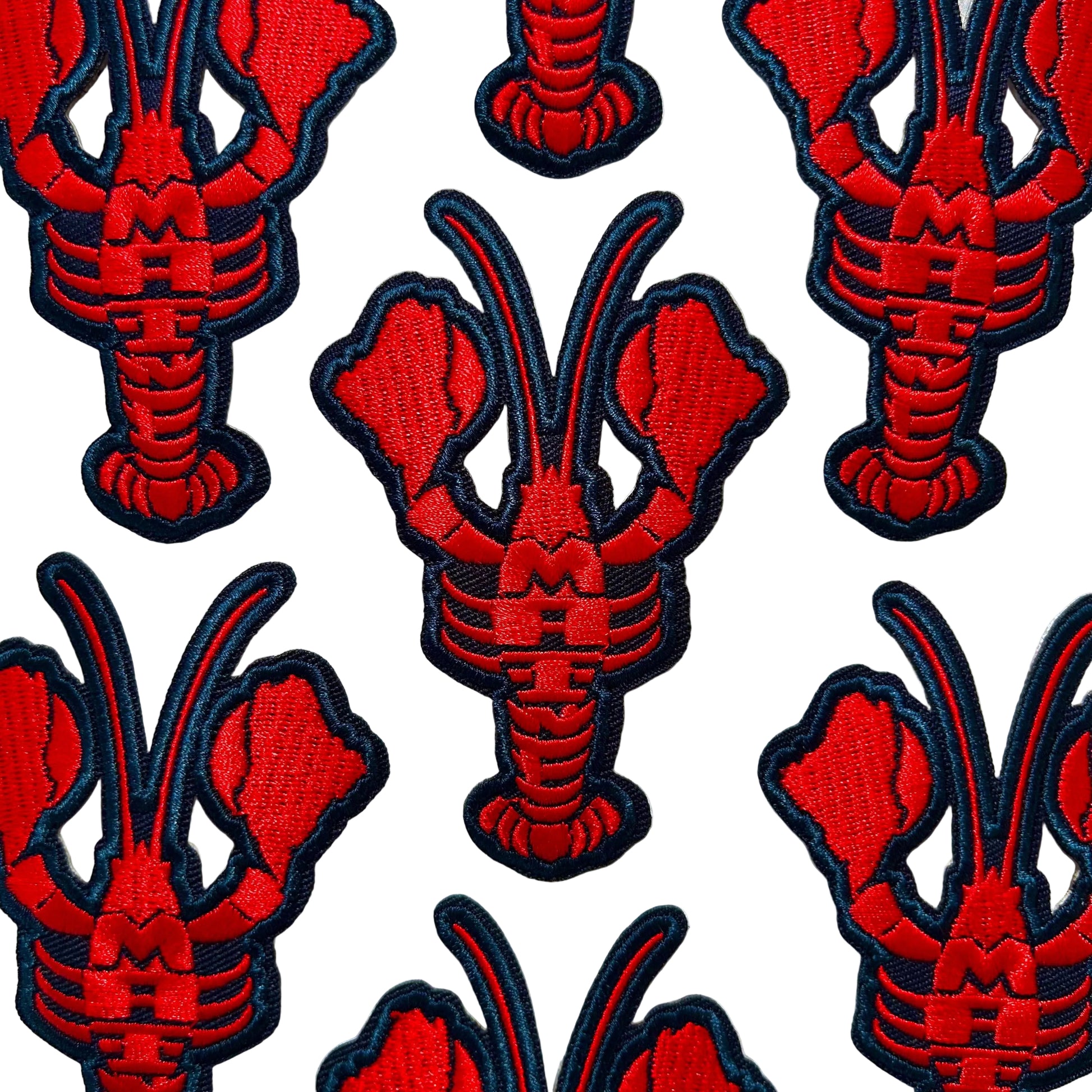 Red and black lobster patches on a white background