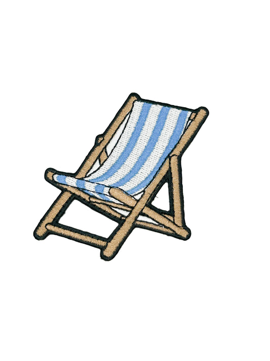 Embroidered striped deck chair with blue and white stripes on a white background