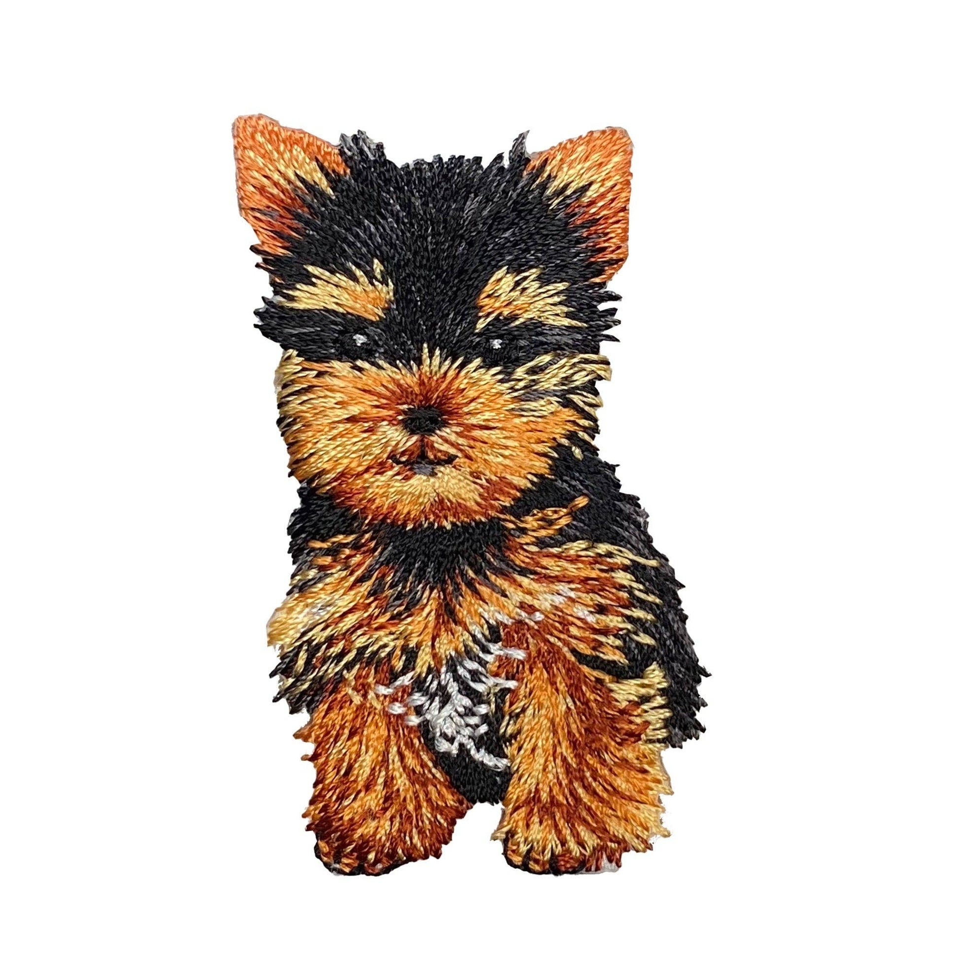 Embroidered patch of a teacup yorkie with black and brown fur on a white background