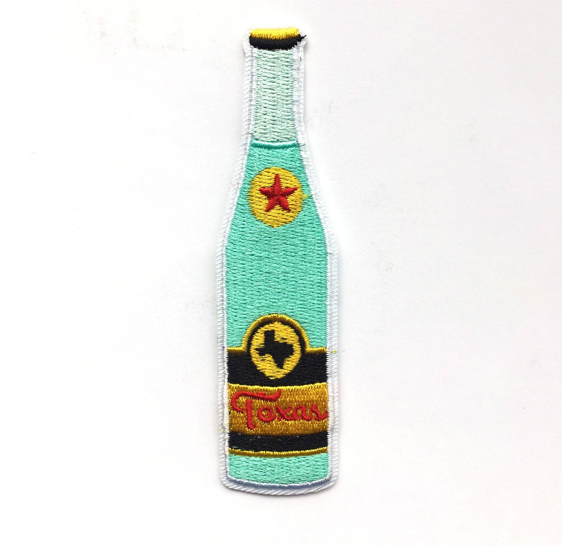Colorful embroidered bottle-shaped patch with a star and text on a white background