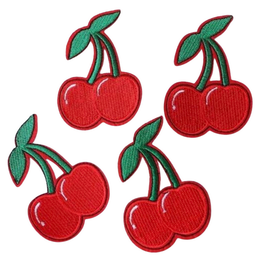 Four red cherry patches with green stems on a white background