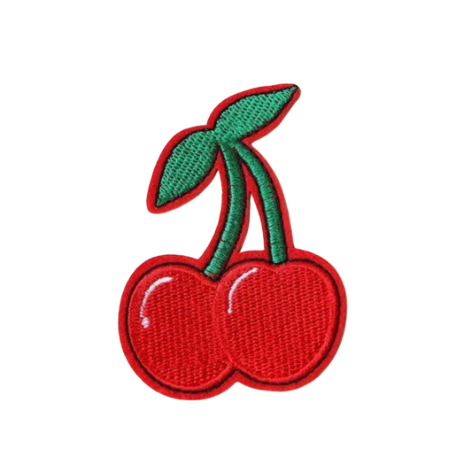Embroidered patch of two red cherries with a green stem on a white background