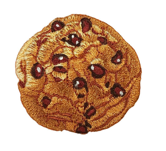 Embroidered patch of a chocolate chip cookie on a white background