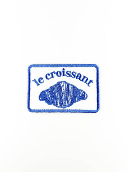 Embroidered patch with 'le croissant' text and a croissant design on a white background