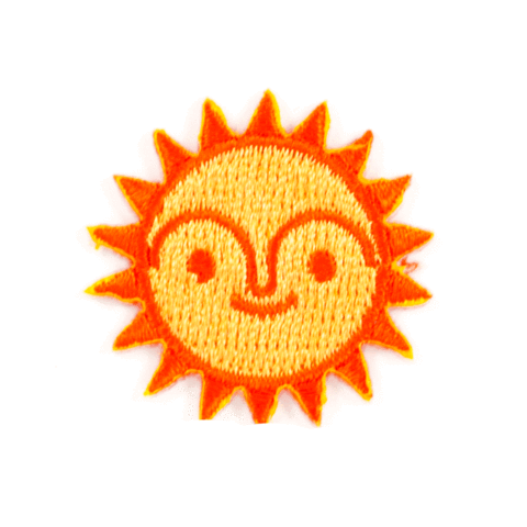 embroidered yellow sun sticker patch with orange outline on white background