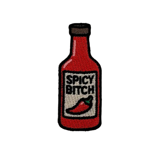 Embroidered patch of a hot sauce bottle with 'Spicy Bitch' text on a white background
