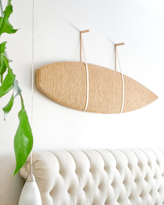 surfboard art hung on wall