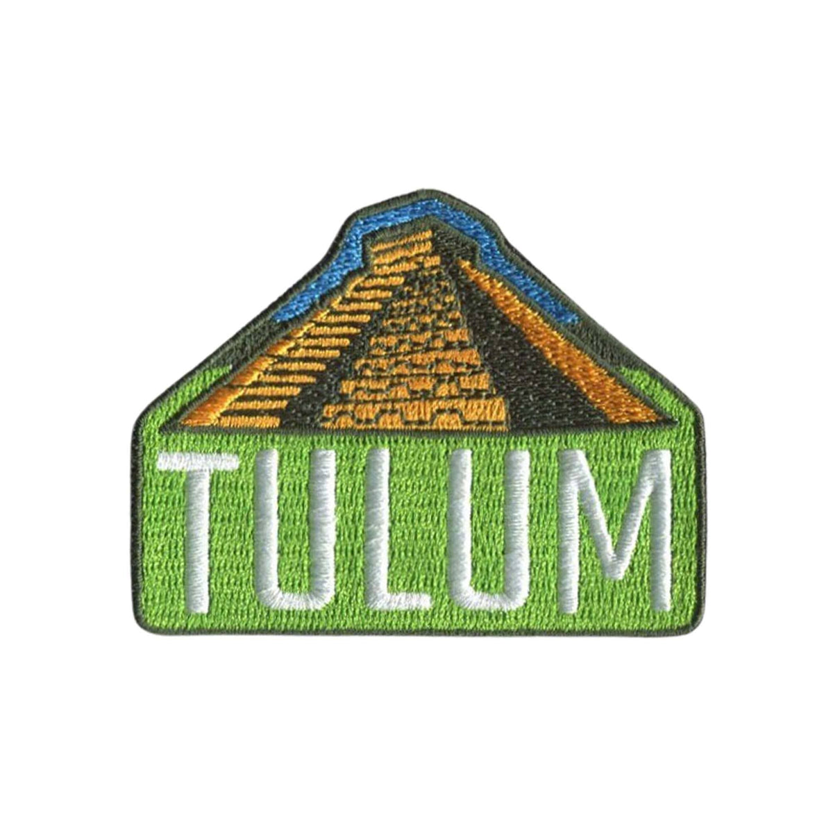 An embroidered patch featuring a green house-shaped border with the word 'TULUM' in white letters across the bottom and a pyramid design in gold, black, and blue above, shown on a plain white background.